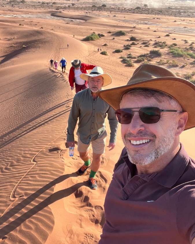 Nanan Travel - Balancing Luxury & Wilderness in African Safaris _ Ultimate Guide-German and Jan with meercats on safari in Botswana