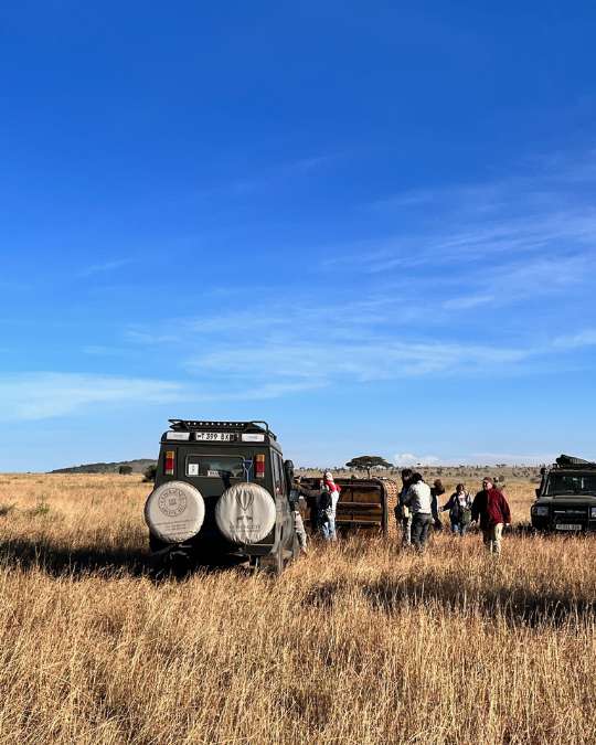 Nanan Travel - Balancing Luxury & Wilderness in African Safaris _ Ultimate Guide-safari break German drinking coffee